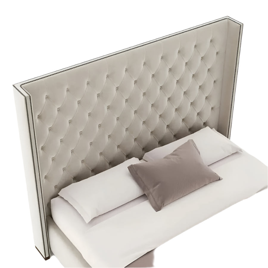 The Dominique bed, featuring a lofty headboard and a well-defined foundation.
