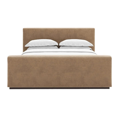 Margot's bed has a tall footboard and an upholstered headboard.
