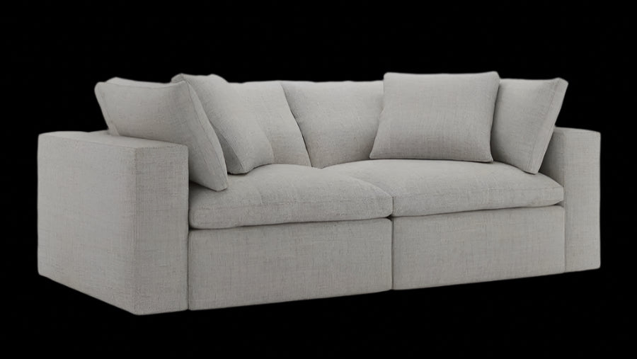 Grey two-seater couch with storage feature and minimalist styling