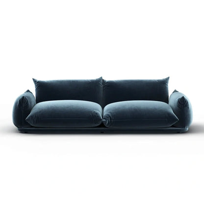 Modern deep blue velvet sofa with oversized cushions and minimalist base design