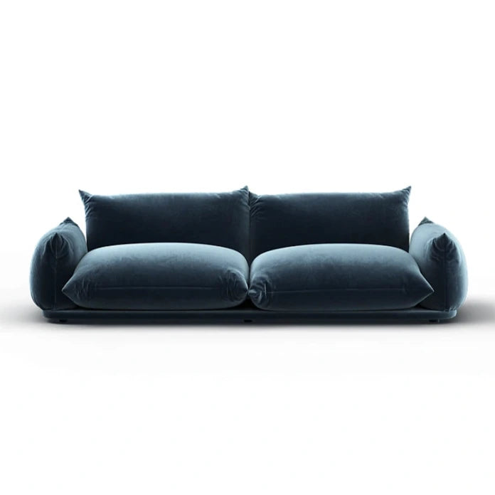 Modern deep blue velvet sofa with oversized cushions and minimalist base design